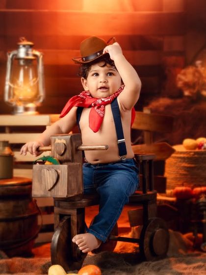 Adjusting his hat, this little cowboy is the picture of toddler charm and attitude.