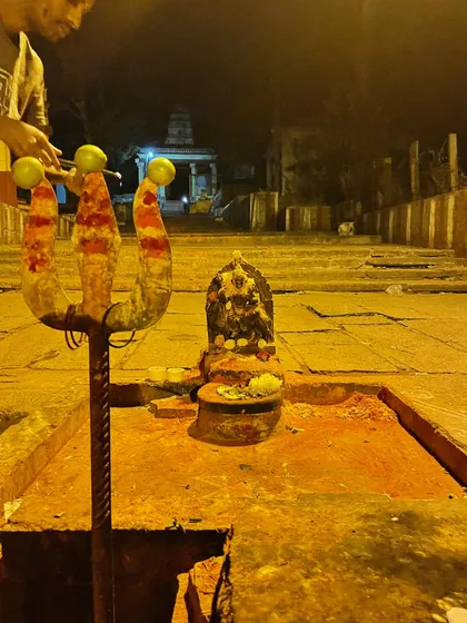 An offering at a temple at night. These rituals are a way to express gratitude and connect with the spiritual dimension of life.