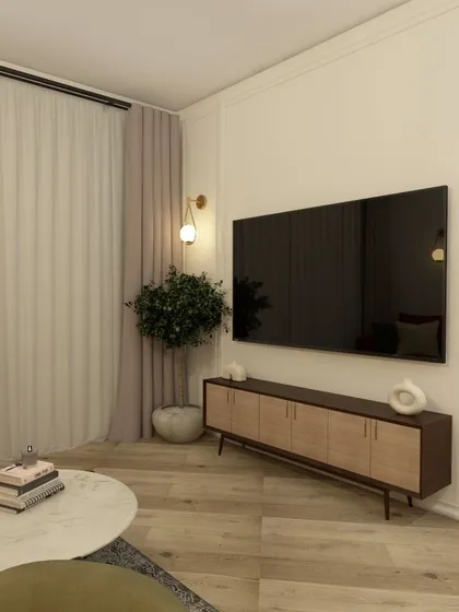 The TV wall in this design is kept simple with a rattan-front console and elegant wall sconces.