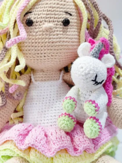 This shot highlights the adorable mini unicorn that comes with the larger doll. It’s a two-in-one gift that adds an extra layer of magic and playfulness.