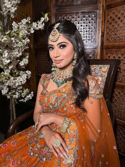 Engagement makeup for our lovely client. She chose a vibrant orange lehenga, so we created a look with defined eyes and glowing skin to match its grandeur.