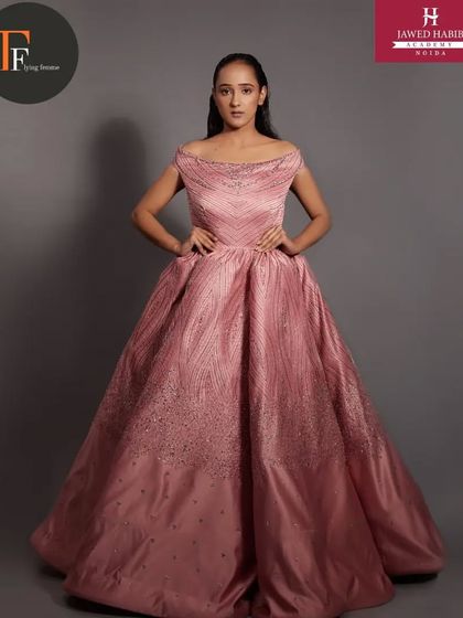 A full-length view of the stunning pink gown, with our students' work completing the fairytale look.