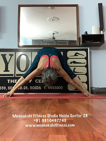Prasarita Padottanasana, the wide-legged forward bend. This variation stretches the hamstrings and inner thighs while also being a gentle inversion.