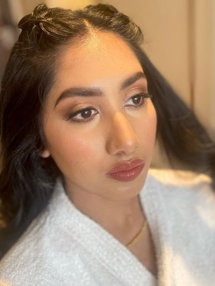 A close-up of the base makeup and soft eye definition before the final styling.