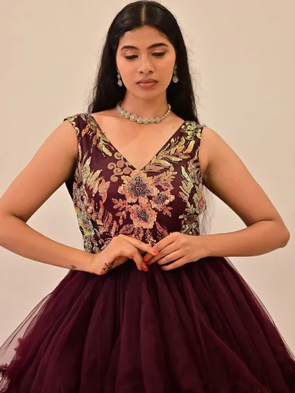 A detailed shot of the bodice and the complementary makeup. The look is all about elegance and grace for this fashion show.