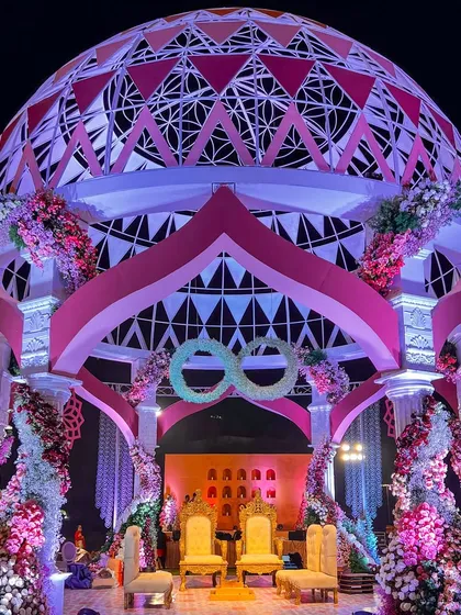 This is our 'Anant' theme, symbolizing an endless love. The magnificent dome mandap, inspired by the sacred Flower of Life, creates a truly spiritual and awe-inspiring centerpiece for the wedding ceremony.