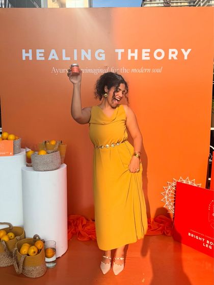 Having fun in the sun at an event for Healing Theory and Jimmy's Beverages. This photo shows me engaging with a brand's product in a real-world event setting, creating authentic lifestyle content.