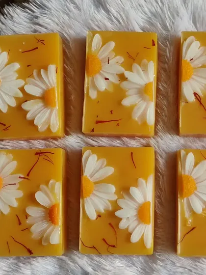 These beautiful kesar milk soaps are embedded with daisy designs and real saffron strands.