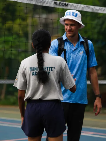 Another angle of a handshake, symbolizing the trust and partnership between coach and player.