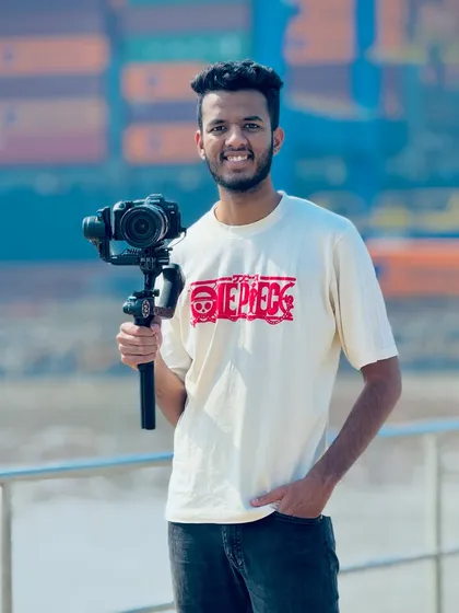 A smiling portrait of me with my camera rig, ready for a day of shooting.