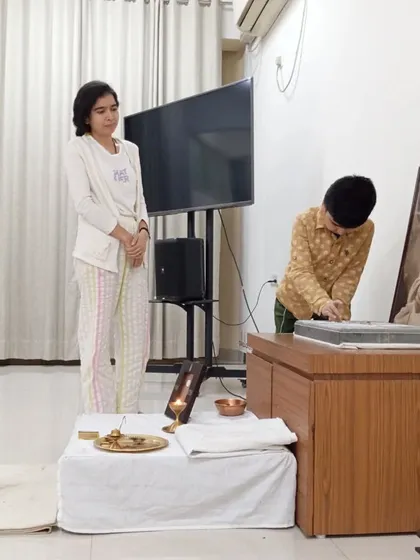 A mother and child making an offering together at the Sadhguru Sannidhi. It is beautiful to see devotion being passed down and shared across generations in our community.