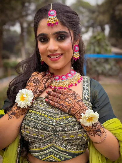 A beautiful bride-to-be, all set for her mehendi function in one of my green lehengas. The floral jewelry completes the look perfectly.