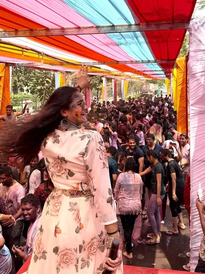 Looking back at the sea of happy, color-soaked faces from the stage. This is what a successful Holi party looks like.