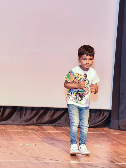 Aadil strikes a pose during his routine, showing the personality and flair we encourage in our students.