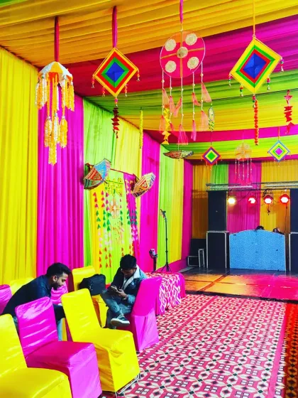 A vibrant tent interior with a DJ setup, perfect for a high-energy Sangeet or cocktail party.