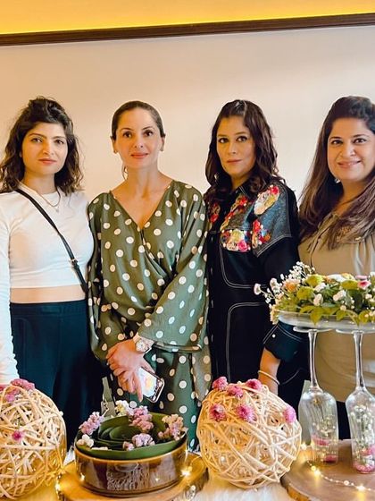 A group of us gathered around the finished table at our Cafe Delhi Heights workshop. The arrangements feature beautiful, natural elements and DIY touches.