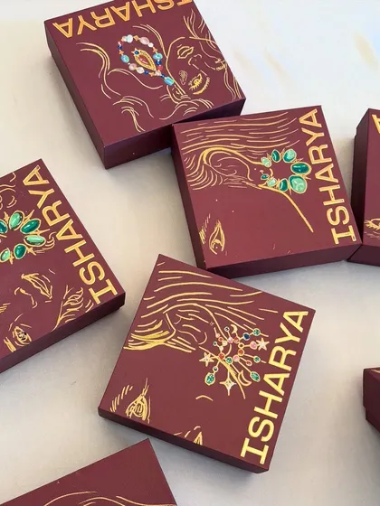 A collection of the custom-illustrated Isharya jewelry boxes.