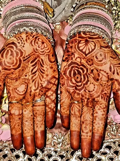 A gorgeous, rich design for a 'Baat Pakki' or engagement ceremony. The deep stain and intricate floral patterns are perfect for the celebration.