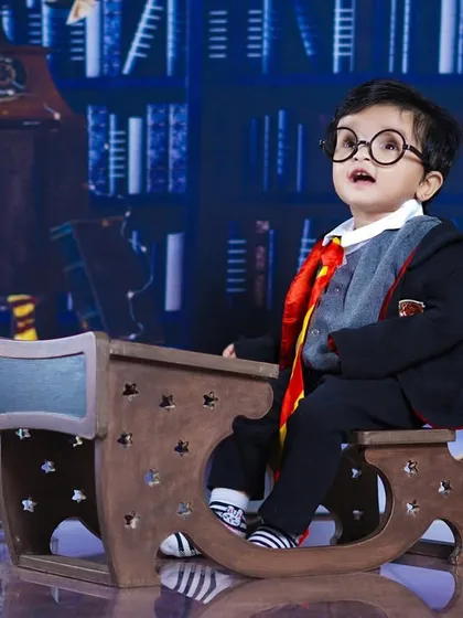 This little wizard, complete with round glasses, looks up in wonder, perfectly capturing the magic of the Harry Potter world.