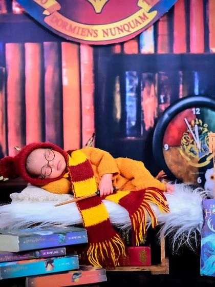 A full setup of the Harry Potter newborn theme, with the baby sleeping amongst books and magical props. This showcases the detail and effort I put into my themed shoots.