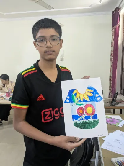 It's great to have Ahmed back in class. He jumped right into our T-shirt design project, creating a bright and cheerful composition with floral elements.