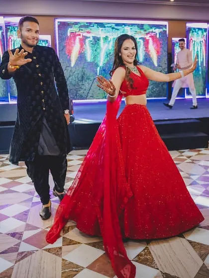 A snapshot from a high-energy sangeet entry. The couple danced their way in, setting the tone for a night of celebration.