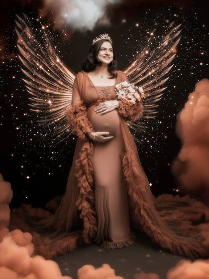 She’s not just expecting, she’s evolving. A queen cloaked in dreams, crowned with strength, and wrapped in the divine magic of motherhood with ethereal wings.