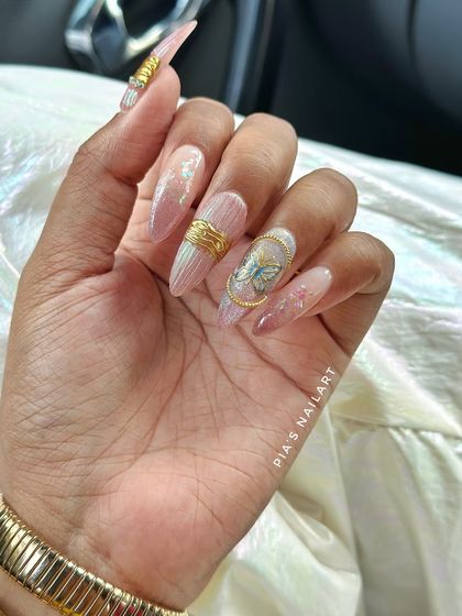 A throwback to my birthday nails. A luxe, custom set with gold chrome, butterflies, and iridescent details.