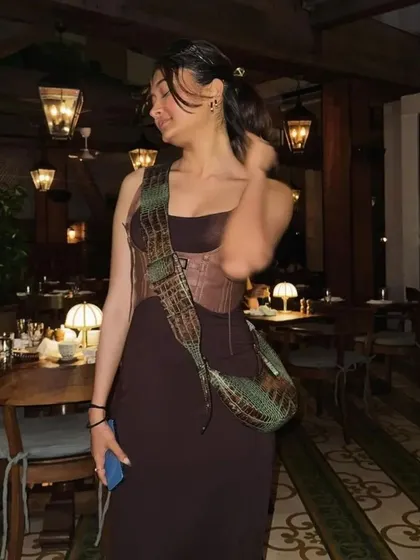 The Selena bag in a multi-toned croc print, styled for a dinner out. The unique colorway makes it a true statement piece.