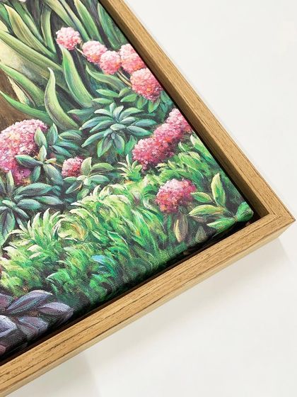 A close-up of the corner of the veneer wooden floater frame, showing the canvas texture and the clean, modern presentation.