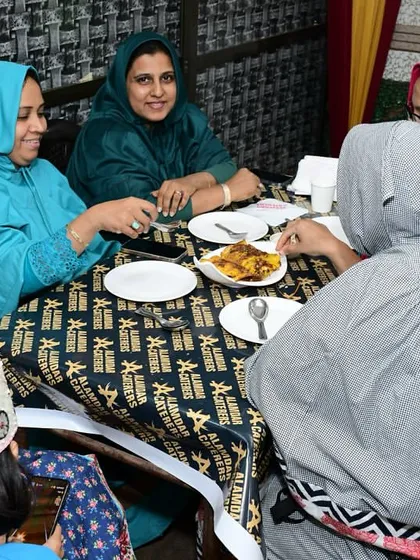 A group of ladies enjoying their food and company.