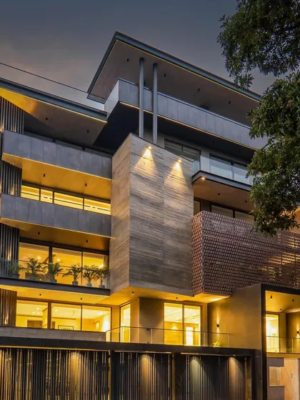 Another night shot revealing the captivating glow of our facade design. The lighting strategy is key to highlighting the architectural forms and creating a warm, welcoming ambiance.
