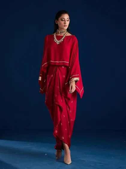 A dynamic walking pose in the Aapro Kimaya Draped Skirt Set, showing the garment in motion.