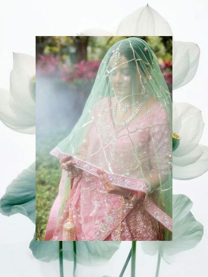 An artistic, dreamy portrait of a bride under her mint green veil, with a soft, misty effect.