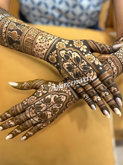 A beautiful example of symmetrical design, with matching floral and lotus patterns on both hands, creating a sense of harmony and balance.