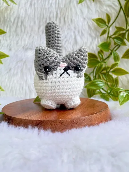 A grumpy but cute little cat plushie. I love his expressive face! This was a custom order to replicate a customer's pet, and I'm so happy with how he turned out.