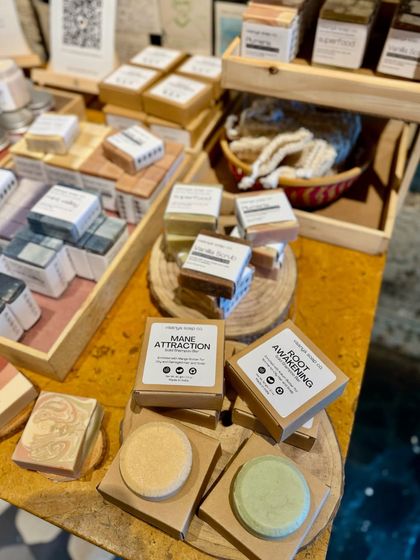 Our pop-up display also features our solid shampoo bars, which are another one of our sustainable, handmade offerings.
