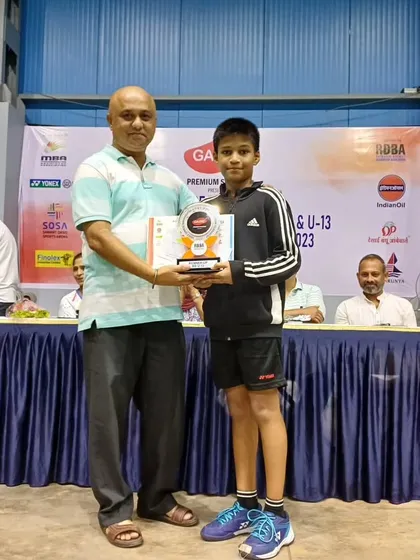 Mayuresh receiving his runner-up trophy for the U-13 boys singles category at the Maharashtra State Badminton tournament.