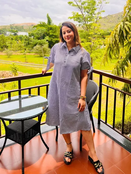 A guest enjoying the view from her balcony. This photo, shared by a visitor, perfectly encapsulates the peace and contentment that our serene environment fosters.
