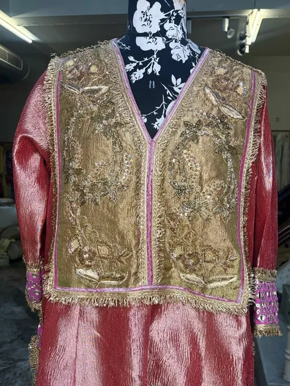 The intricate zari and sequin work on the yoke is all done by hand.