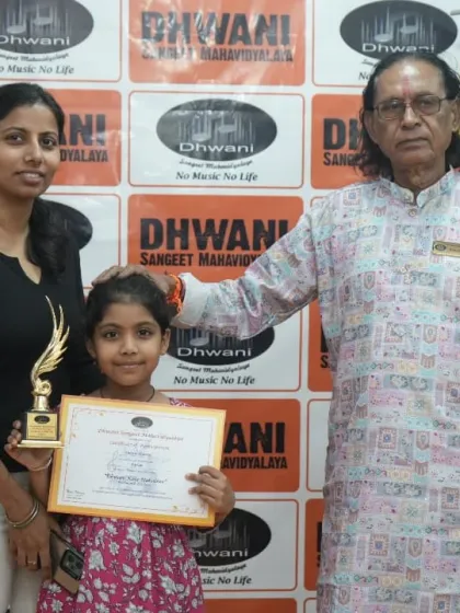 A student, her mother, and our senior guru share a happy moment.