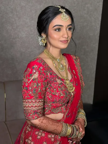 A side profile showing the soft shimmer on the eyes and the flawless blend of her makeup. This look is poetry in soft glam.