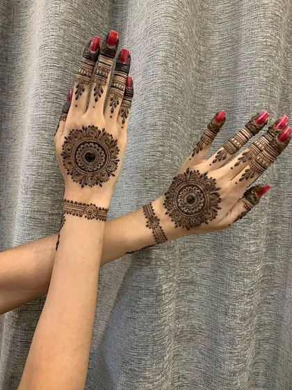 A lovely view of matching mandala designs with detailed finger work, perfect for any celebration.