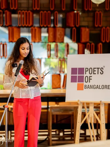 A young poet reads from her book, offering a fresh perspective on the "Wheel of Life".