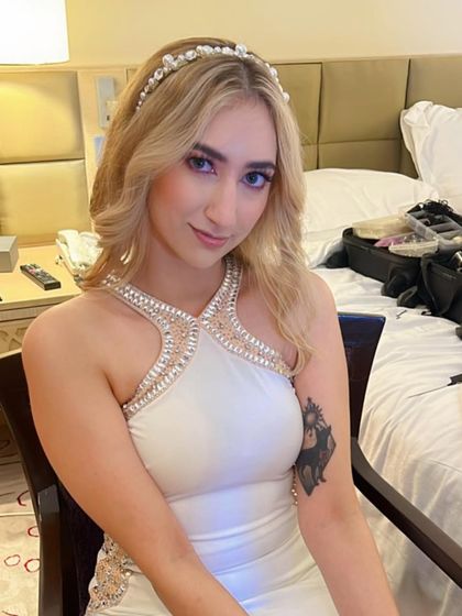 Matte makeup with a pop of color on the eyes. This look was created for a client with beautiful blonde hair and fair skin, using pink and purple tones to make her blue eyes stand out.