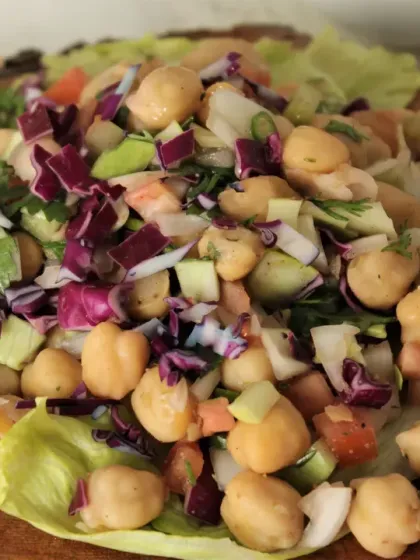 A close-up of our fresh chana salad. You can see the crisp texture of the chickpeas and vegetables. This is a great example of how we make healthy food visually appealing and delicious.