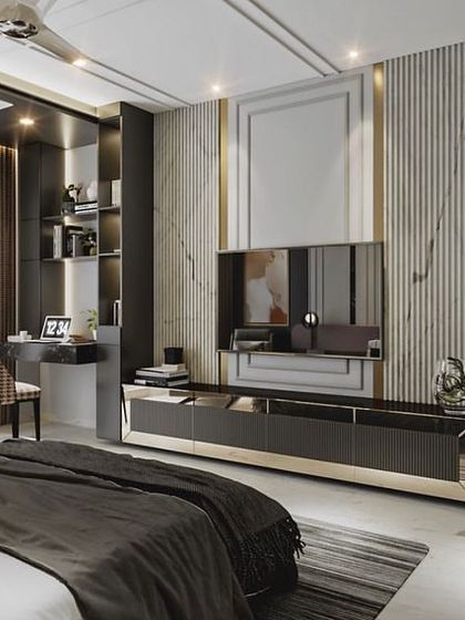 A master bedroom render showing a sophisticated TV wall with integrated shelving and a study desk. The design uses a mix of fluted panels, marble, and reflective surfaces.