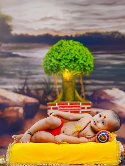 A relaxed pose, with the baby lying comfortably on a yellow cushion, embodying the peace and serenity of Swami Samarth.