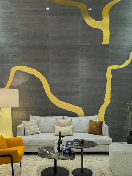 Inspired by the ancient Japanese art of Kintsugi, this award-winning metallic leaf wallcovering is a true standout. Its grand-scale design celebrates the beauty of imperfection, bringing a story of resilience and timeless artistry to the interior.