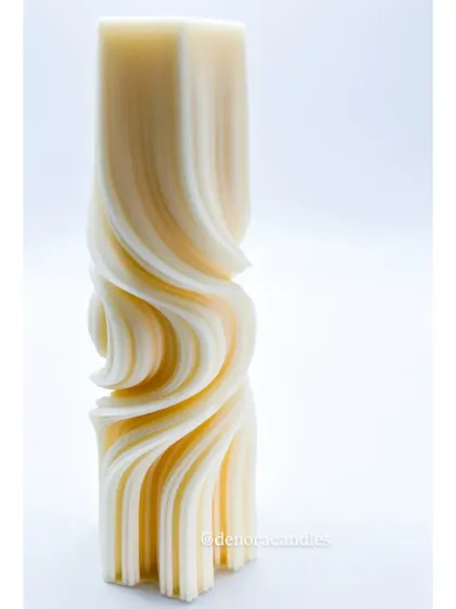 A studio shot of the wave twisted pillar candle against a clean white background, highlighting its sculptural form.
